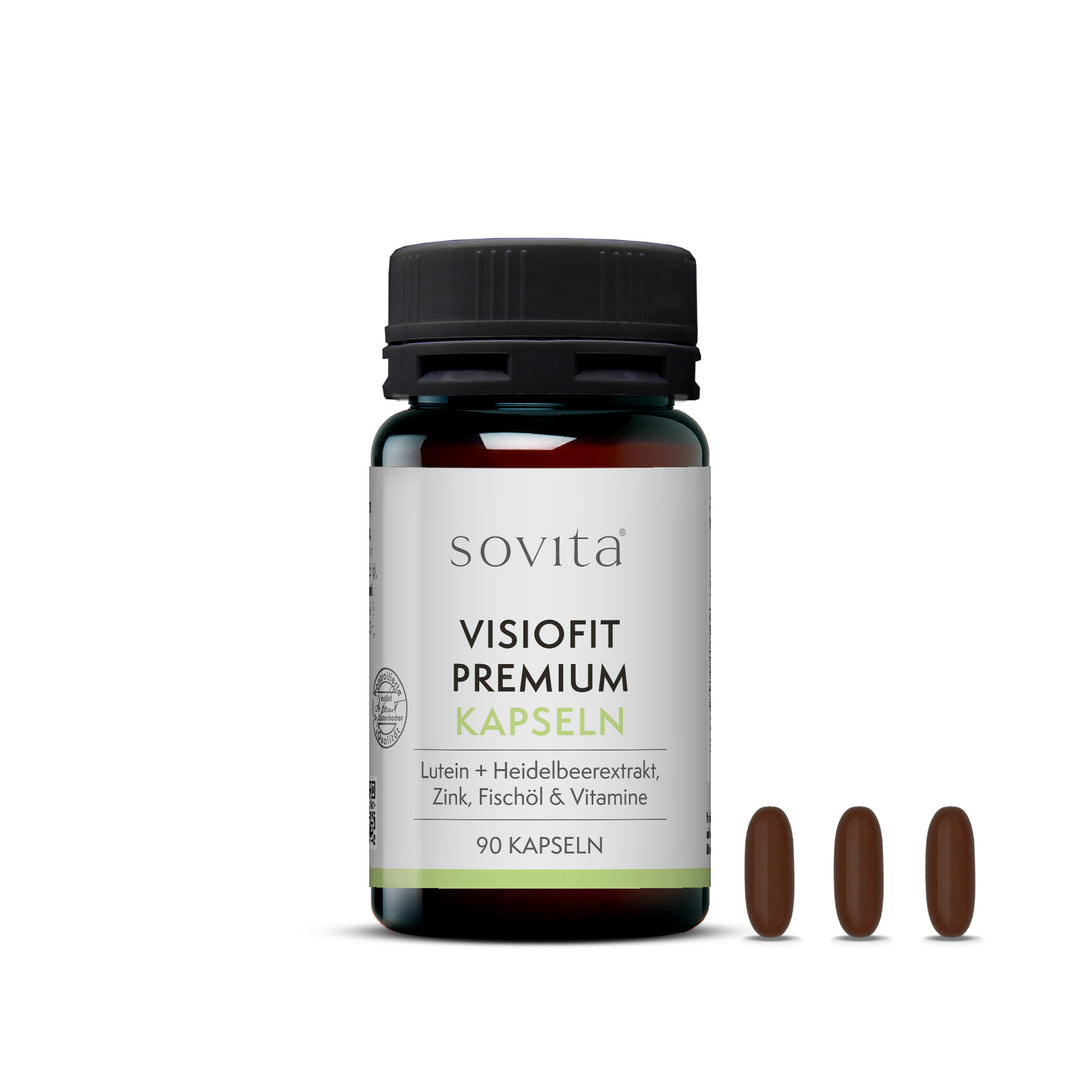 Sovita Visiofit Premium Kapseln in braunglasähnlichem Kunststoffbehälter mit drei nebeneinanderliegenden, ovalen Kapseln im Vordergrund.